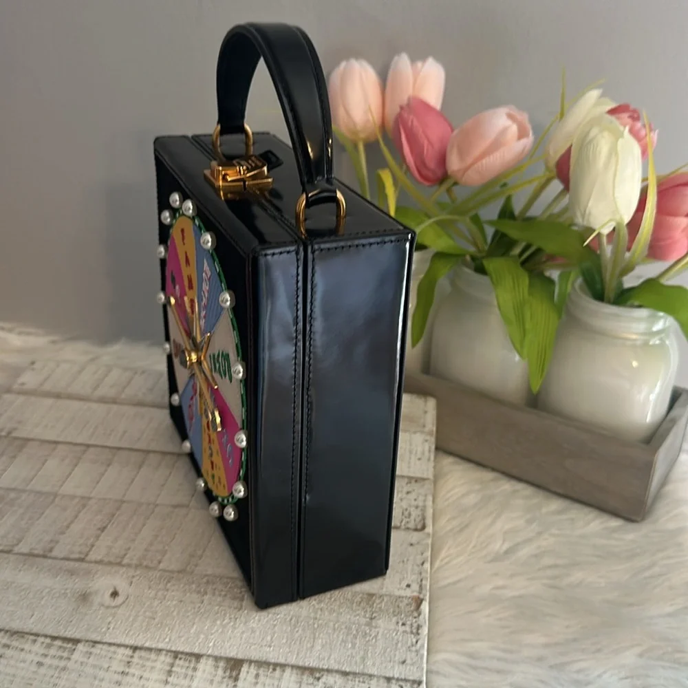 Kate spade fortune favors 3D embellished wheel bag